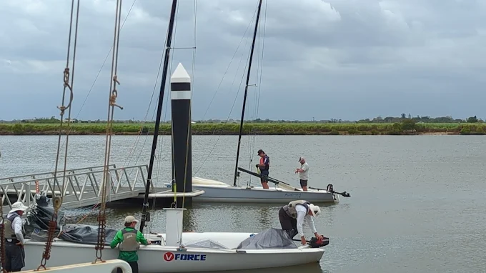 Members rigging a yacht at the club pontoon